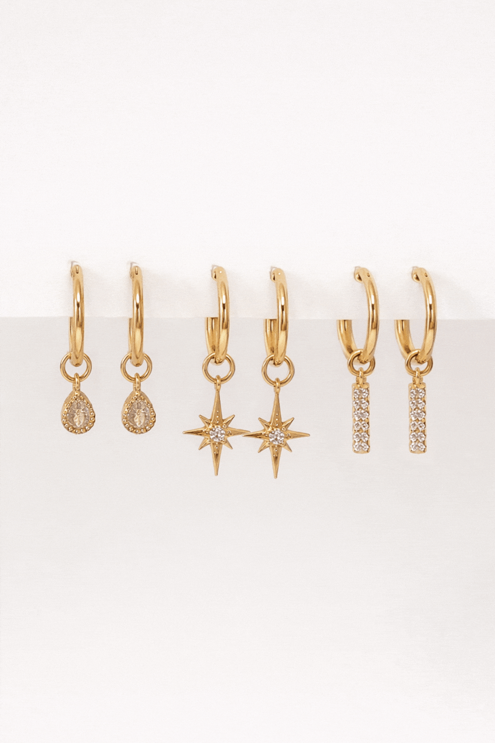 Hoop earrings with replaceable pendants