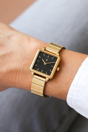 Rectangle watch with a golden strap