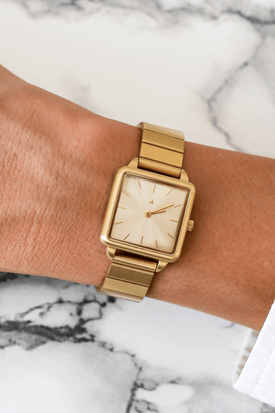 Rectangle watch with a golden strap